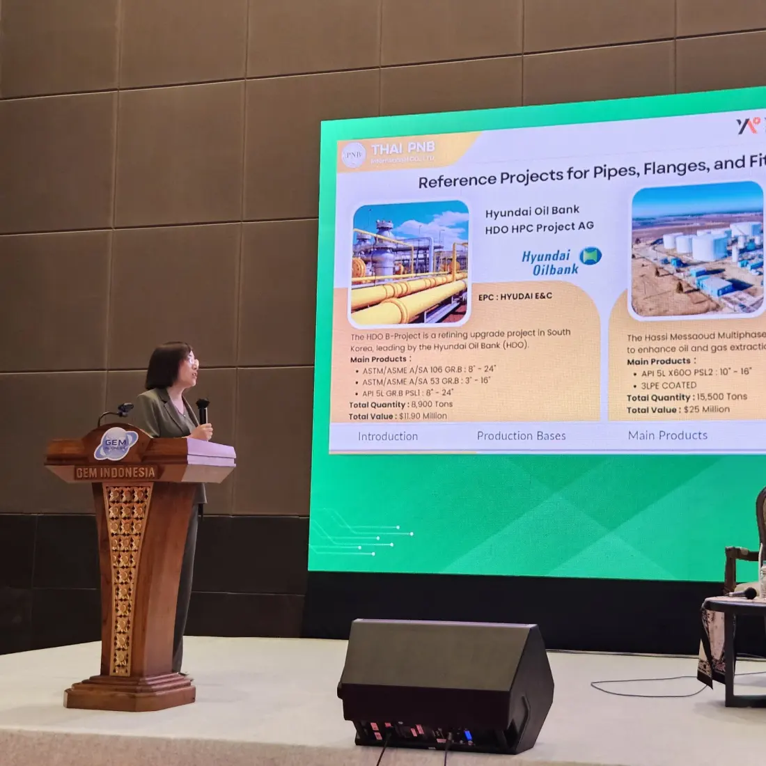 Sales representative presenting pipe, flange, and fitting project cases at an industry conference