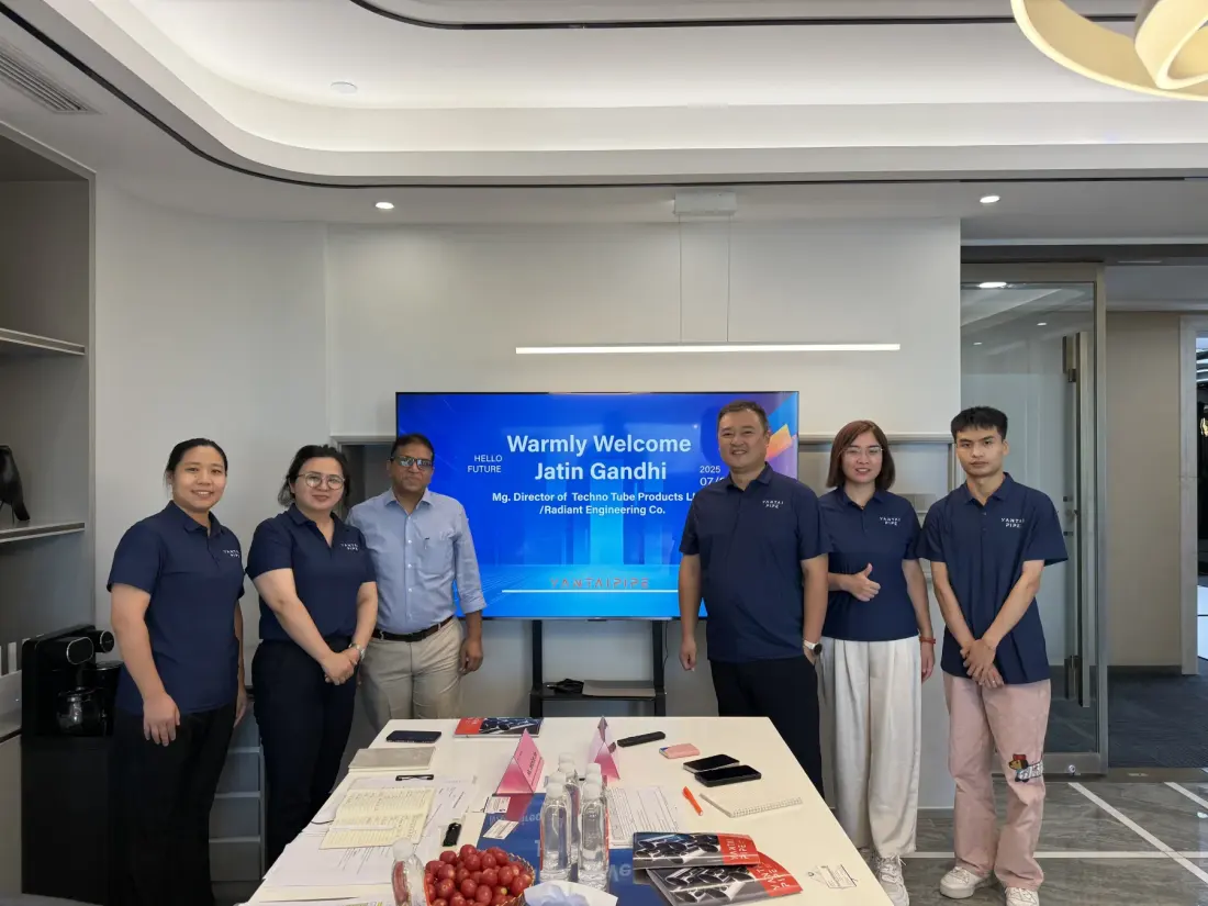 Sales team welcoming an Indian customer in the meeting room