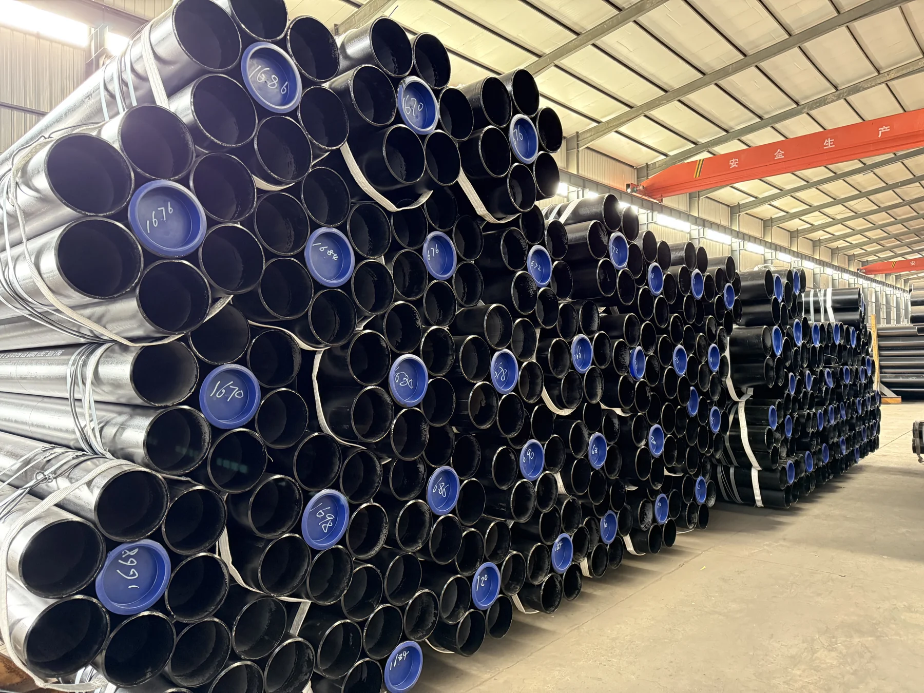 Protected pipe ends and strapped bundles