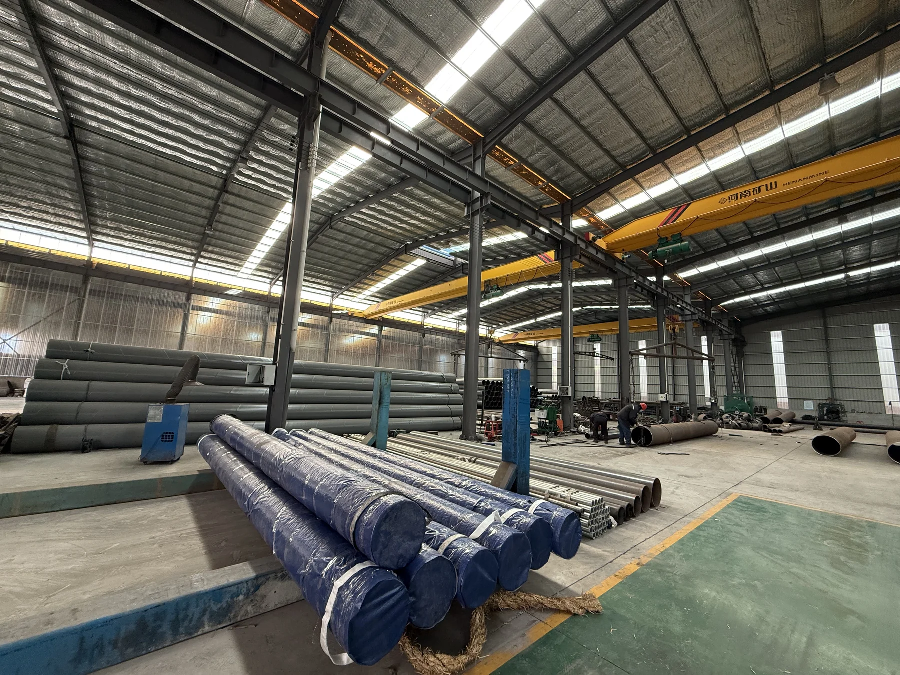 Wrapped steel pipes and warehouse handling area