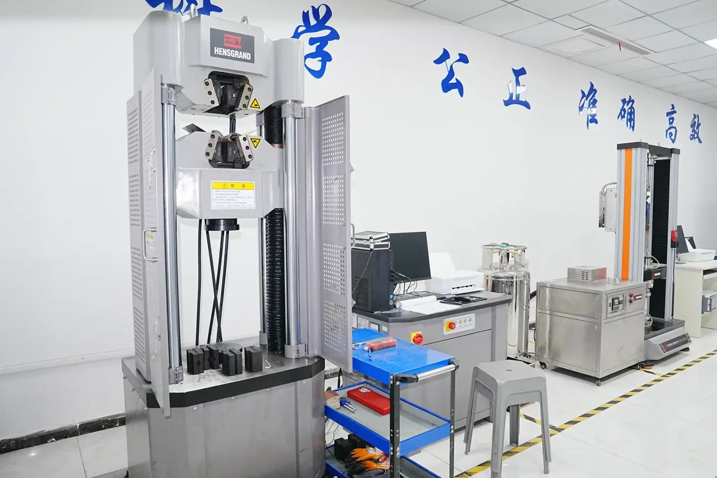 Tensile testing machine checking pipe fitting mechanical properties